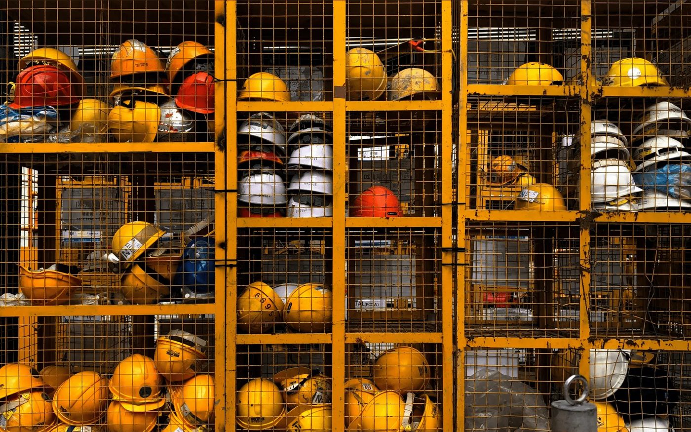 Hard hats racked in a site store
