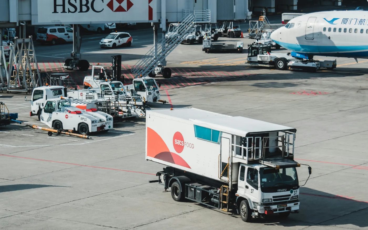 A mixed service fleet parked on an airport apron
